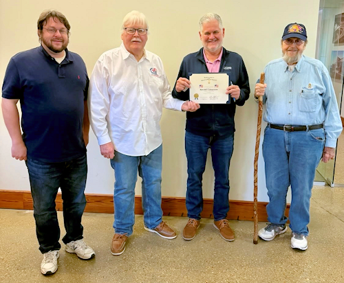 Jeff Robichaux, COO of Ratcliff Construction, was presented with a Flag Certificate for Ratcliff Companies.