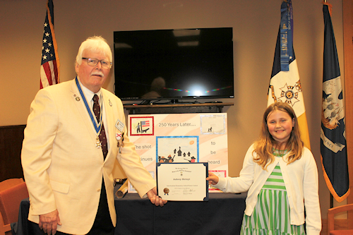 President Compton presented the 2023 Dr. Enemund Meullion Chapter Americanism Poster Contest Winner Aubrey Birinyi with a certificate and a $50 check. Birinyi's topic was Lexington & Concord – the shot heard round the world – and she discussed how “the shot” continues through history