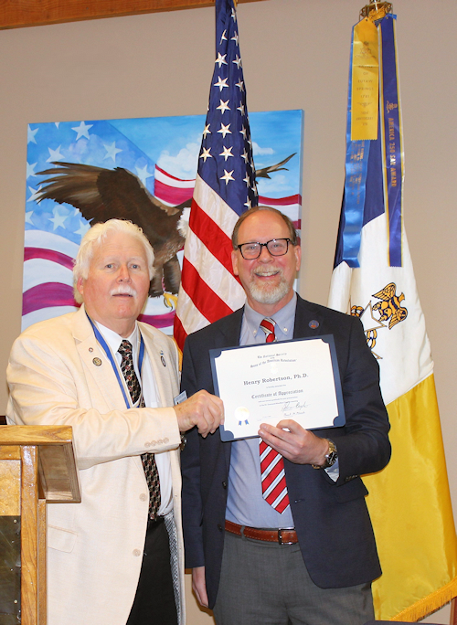 Chapter President Gervais Compton presents Henry Robertson, Ph.D., a certificate of appreciation and an LASSAR mug for his presentation "The Battle of Eutaw Springs, SC, in Myth and Memory."