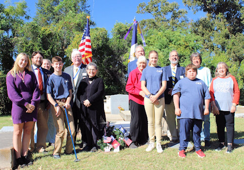 Prior to the chapter meeting, Dr. Enemund Meullion Chapter members, Fort Jesup C.A.R. members, LASSAR Ladies Auxiliary members, and guests met at the grave of Dr. Enemund Meullion for the Annual Wreath Laying in Old Rapides Cemetery. From left: Allie Tarver (Louisiana State C.A.R. Pres.), Secretary Brent Morock, Tori Flynn (Ft. Jesup C.A.R. Senior Pres.), Nicholas Tarver (C.A.R.), President Gervais Compton, Cheryl Morock (Aux. VP), Michael Wynne, Mary Beth Tarver, Hannah Flynn (Ft. Jesup C.A.R. Pres.), Natchitoches Chapter President Tony Vets, Hayden Tarver (C.A.R.), Taylor Thompson (Dr. E.M.), and Liz Lindsay (Aux.).